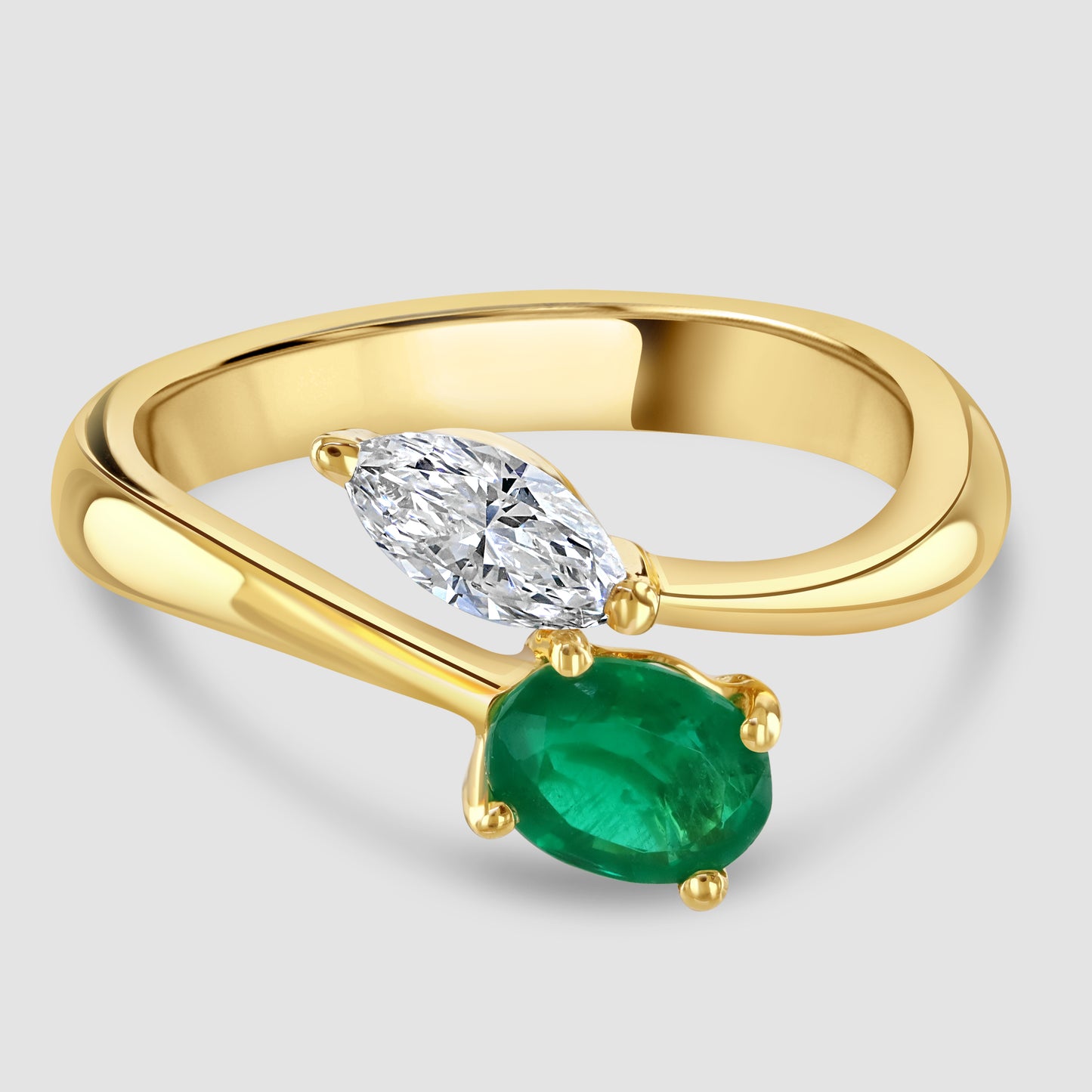 Moi et Toi emerald and diamond crossover ring
