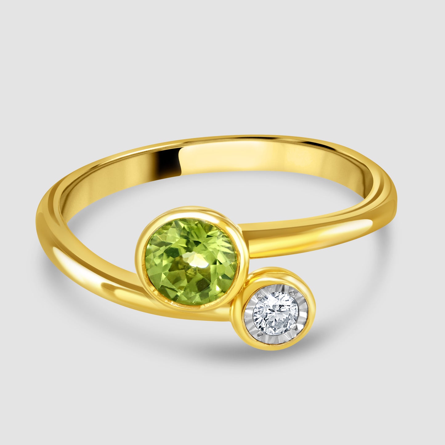 Contemporary peridot and diamond cross over ring