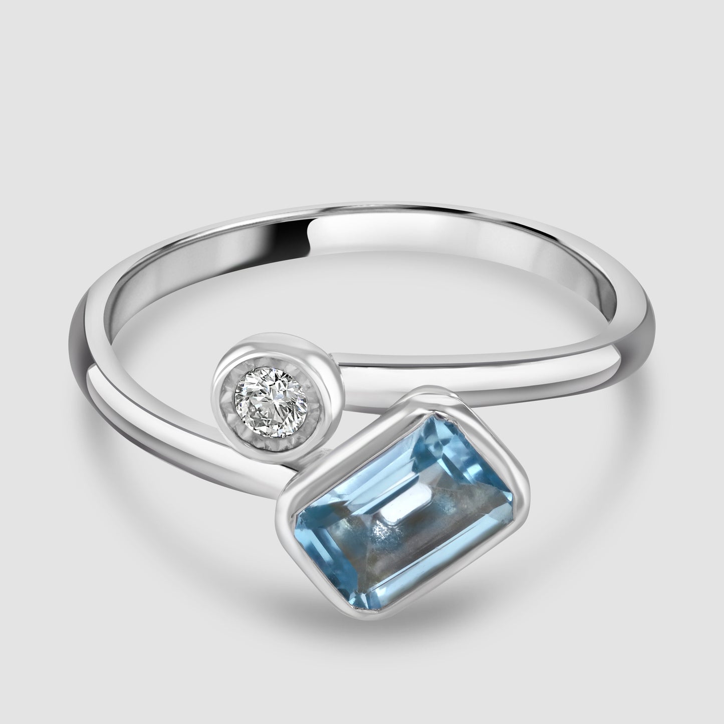 Blue Topaz and diamond cross over ring