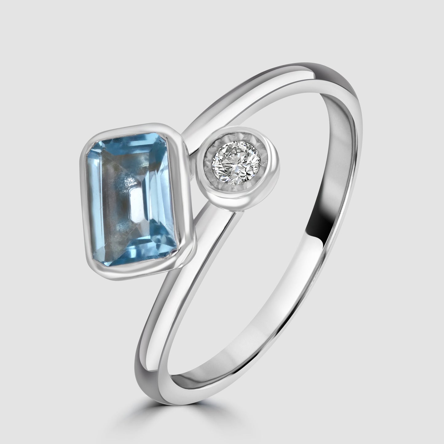Blue Topaz and diamond cross over ring