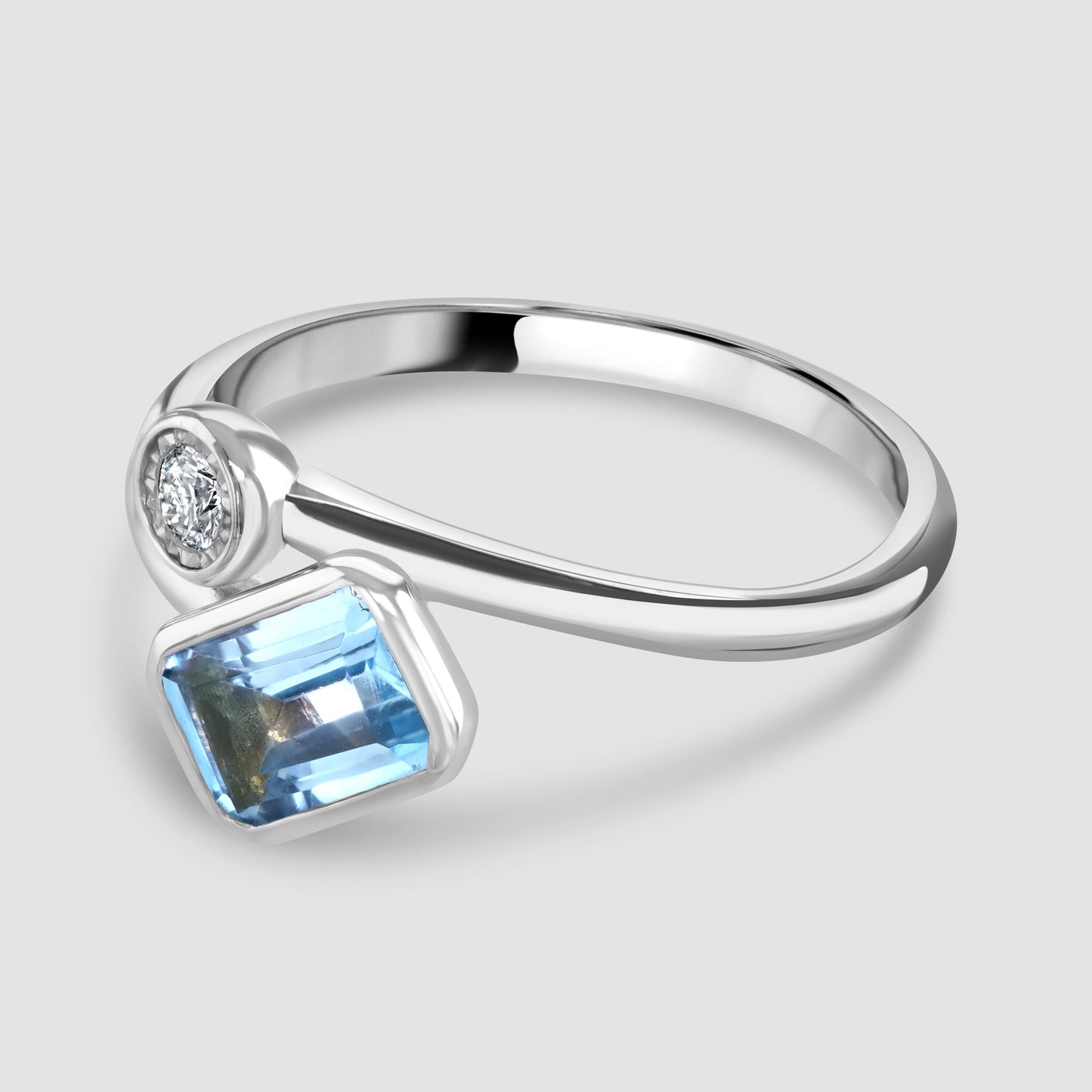Blue Topaz and diamond cross over ring