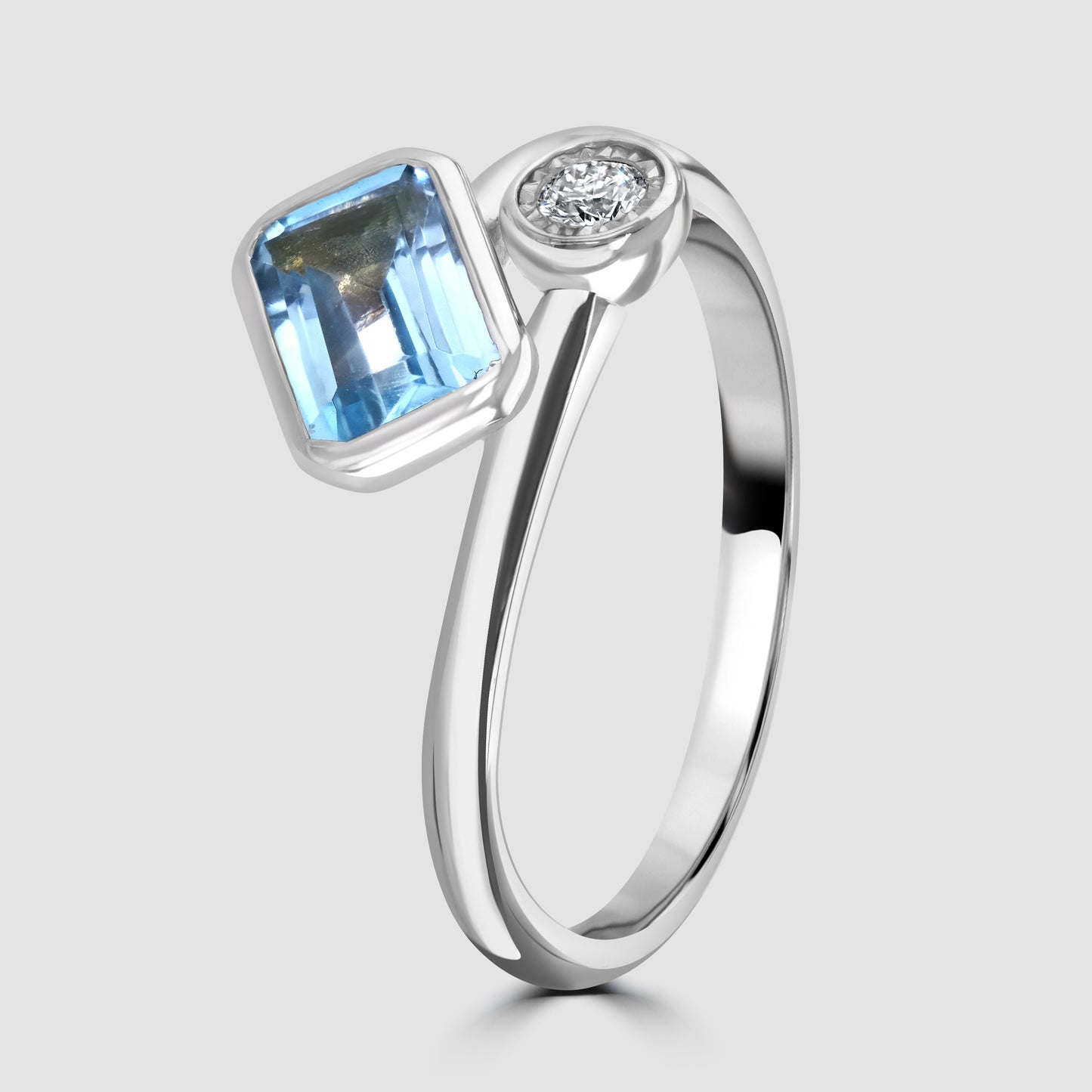 Blue Topaz and diamond cross over ring
