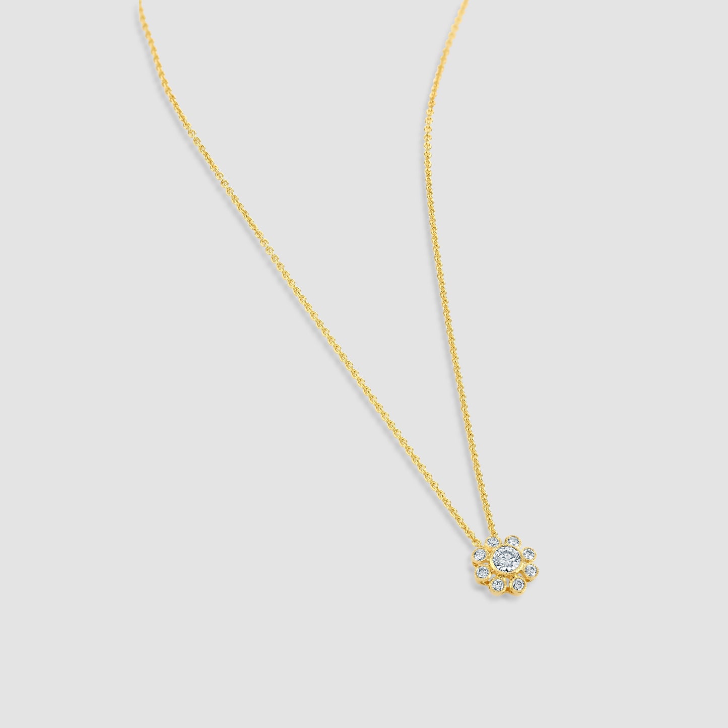 Millgrain edge diamond set floral pendant