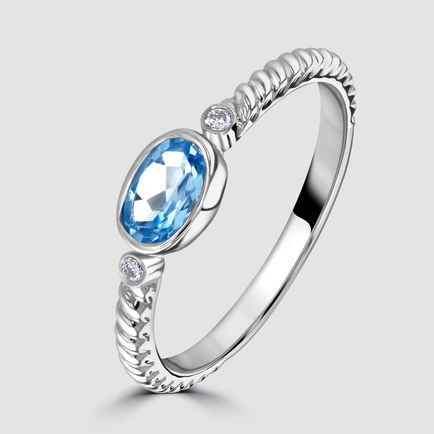 White gold blue topaz and diamond ring
