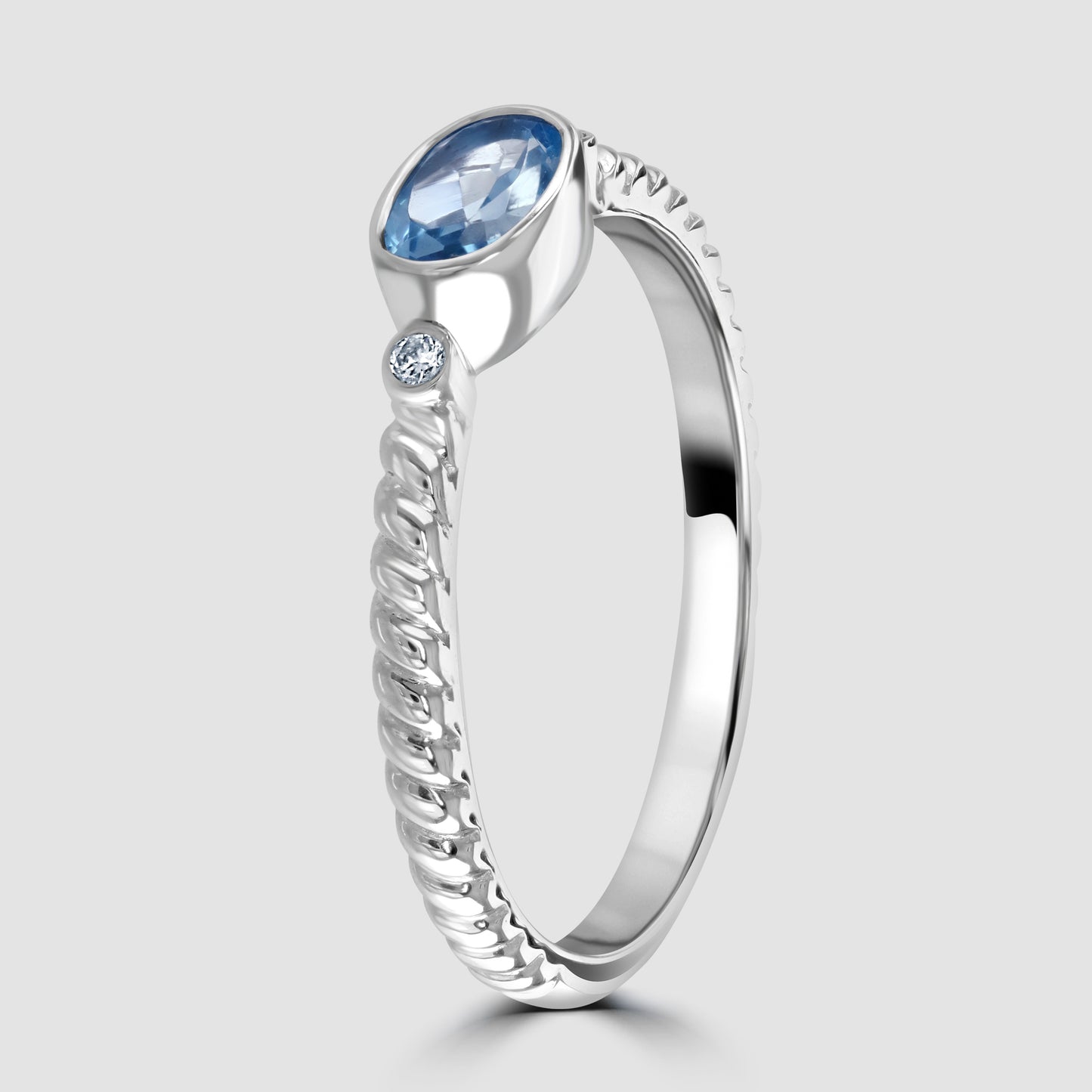 White gold blue topaz and diamond ring