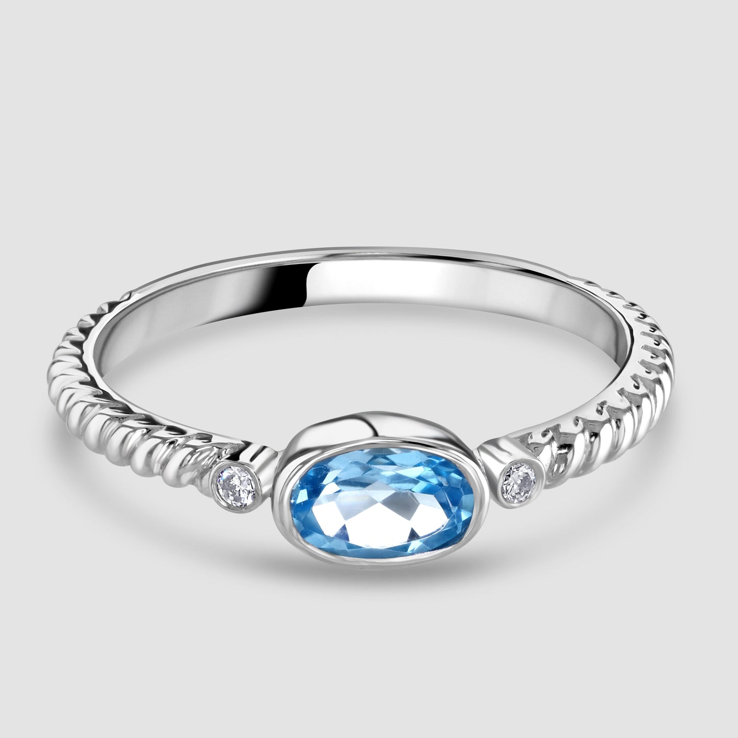 White gold blue topaz and diamond ring