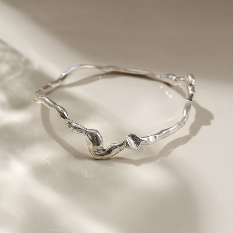 A Wiggle Molten Sterling Silver Bangle from Lulu and Boo Jewellery.