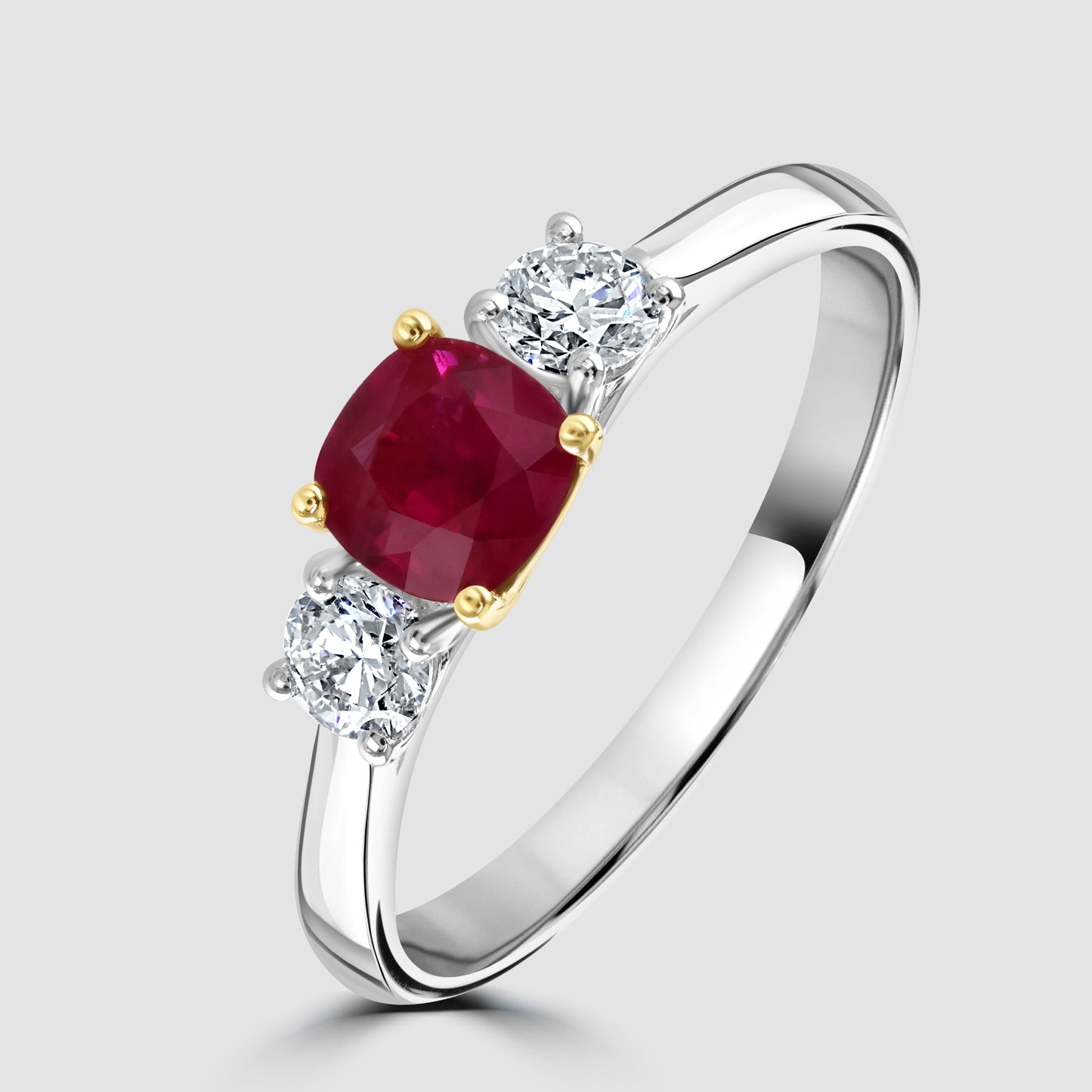 Ruby and diamond claw set three stone ring