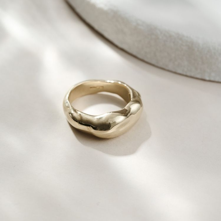 An 18ct gold wedding band from Lulu and Boo Jewellery.
