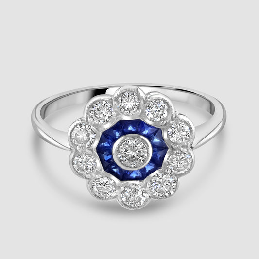 Circular sapphire and diamond cluster ring