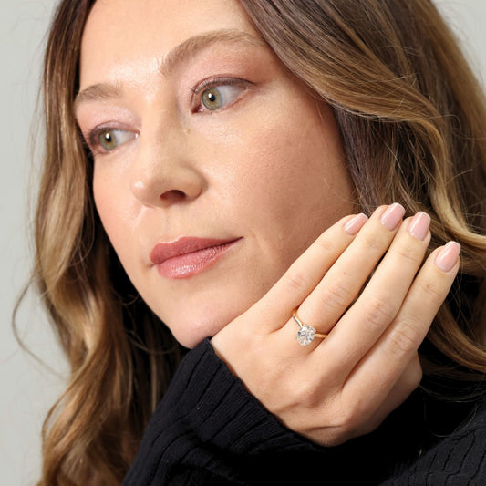 Oval cut laboratory diamond solitaire ring with ‘Bloom’ setting