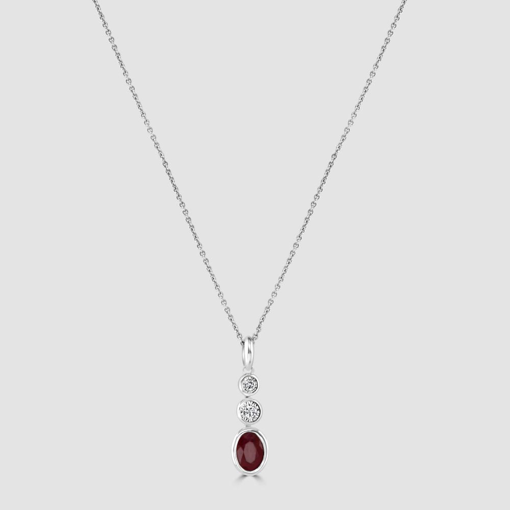 Rub over set ruby and diamond three stone pendant and chain
