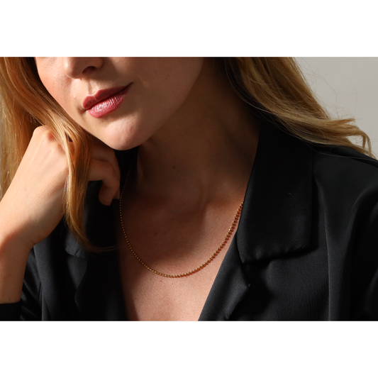 Faceted bead necklace in hi carat gold