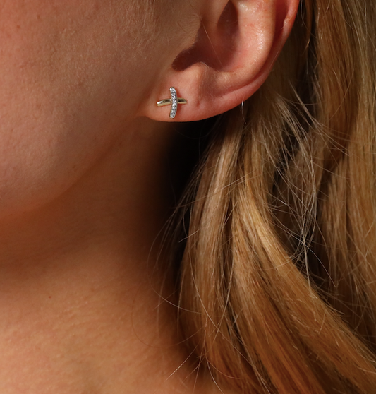 Diamond set kiss cross stud earrings