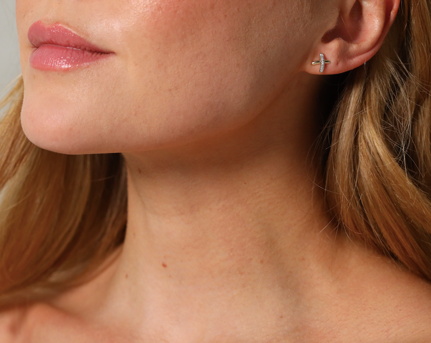 Diamond set kiss cross stud earrings