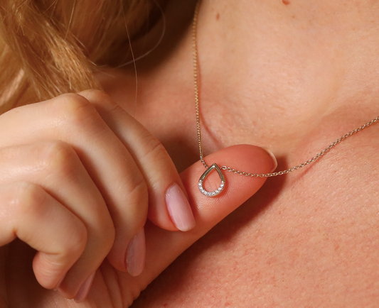 Teardrop pendant set with diamonds and chain