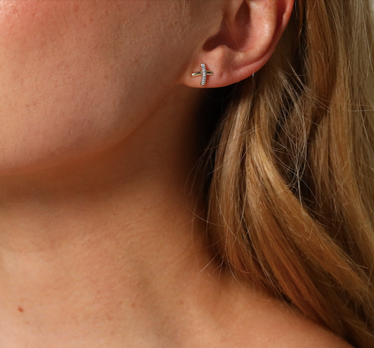 Diamond set kiss cross stud earrings