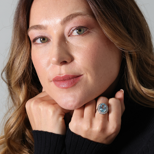 Oval aquamarine and diamond cluster ring