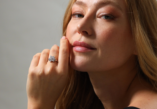 Floral white and blue diamond ring by ‘Hirsh’