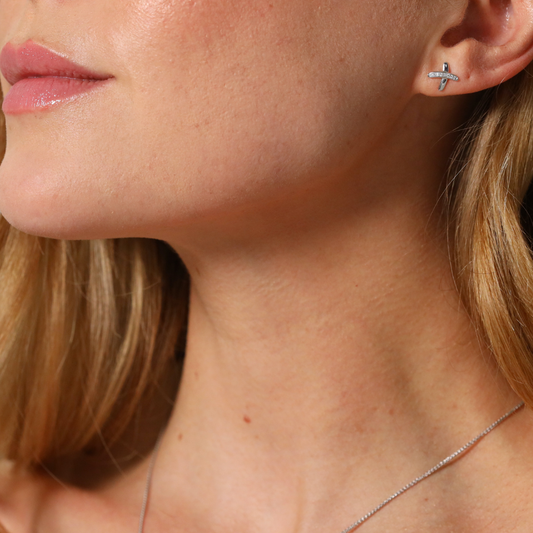 Diamond set kiss cross stud earrings