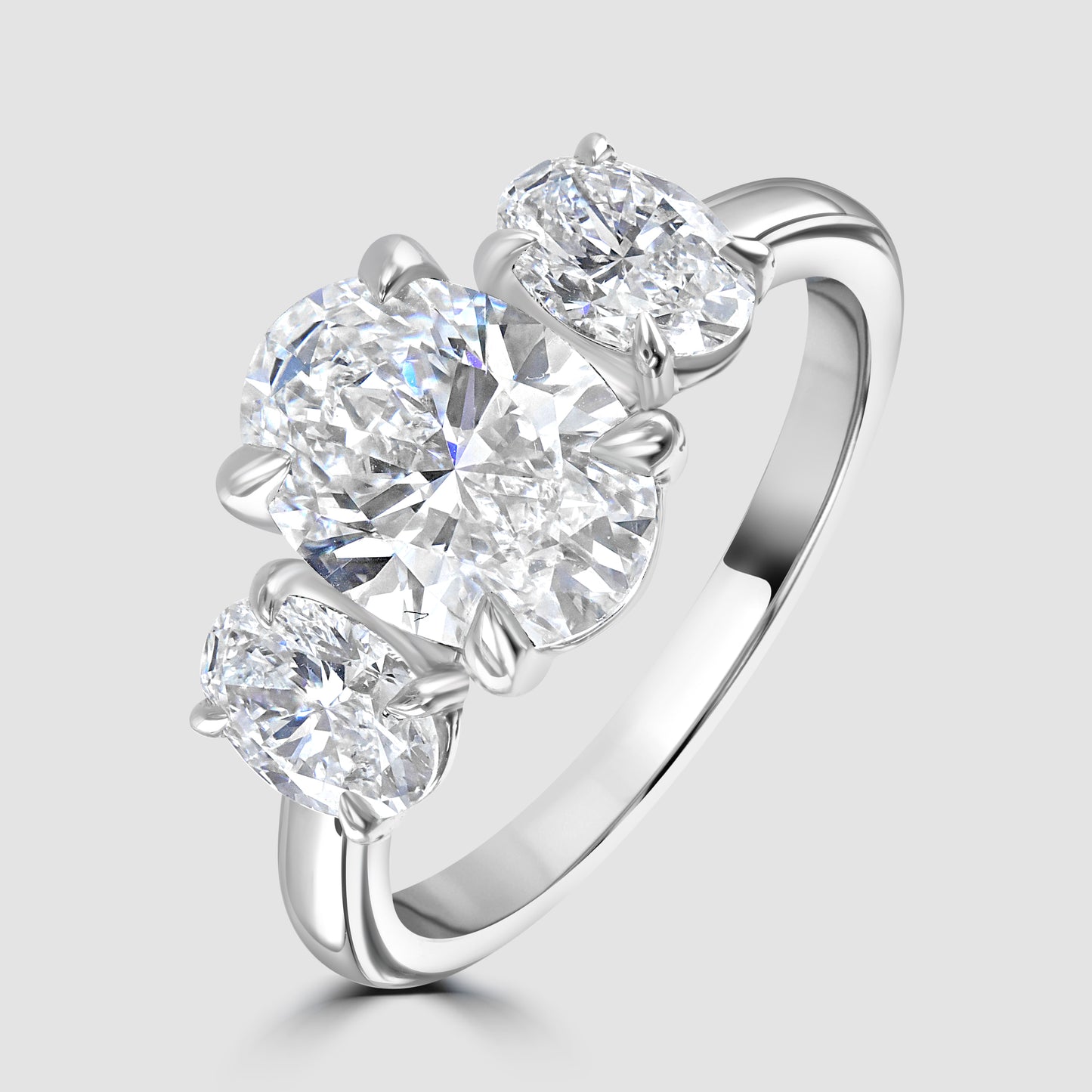 Three stone oval cut Laboratory diamond ring in platinum