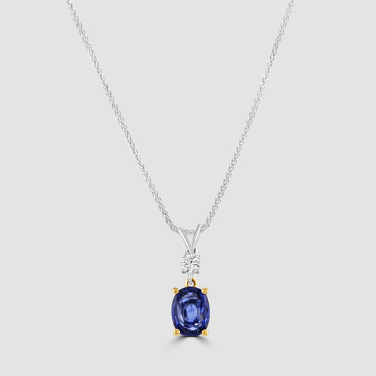 Oval sapphire and diamond pendant set and chain