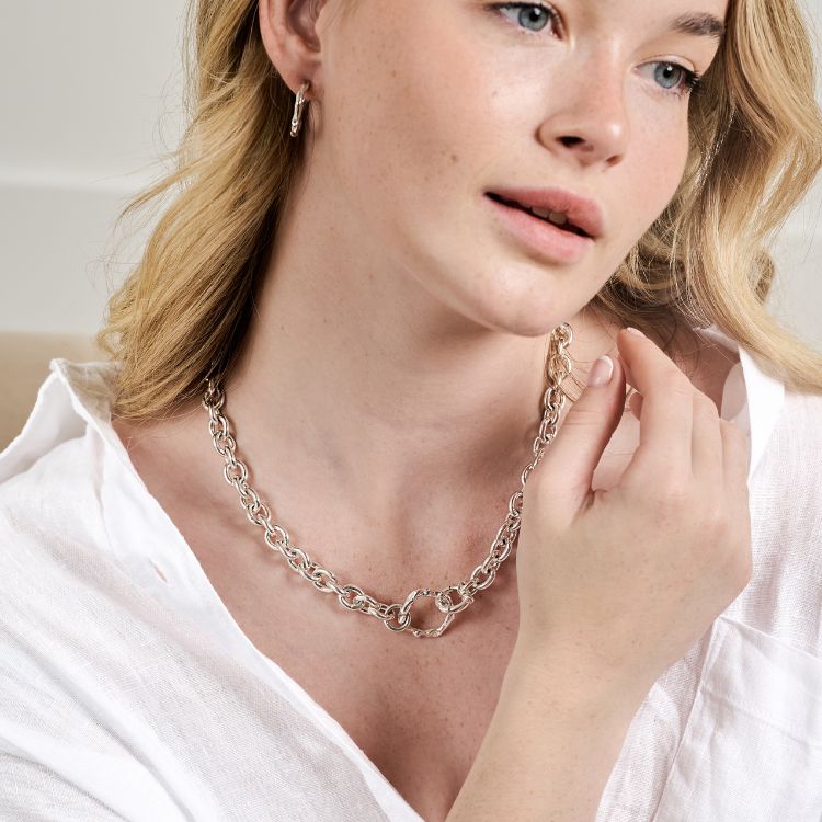 A Molten Halo Chunky Sterling Silver Choker and hoop earrings from Lulu and Boo.