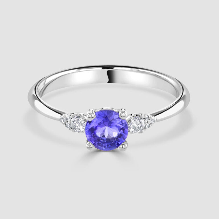 18ct white gold, tanzanite with pear shape diamond shoulders