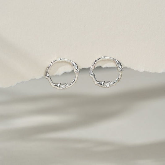 A pair of Silver Halo Stud Earrings from Lulu and Boo Jewellery.