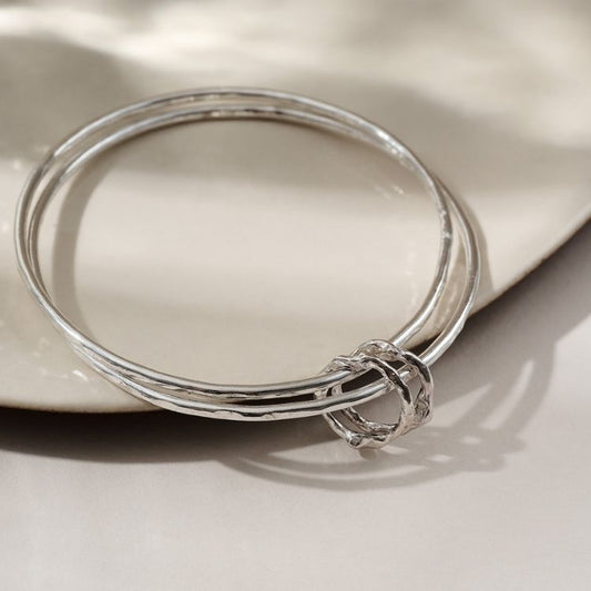 Molten Halo Sterling Silver Charm Bangle from Lulu and Boo Jewellery.
