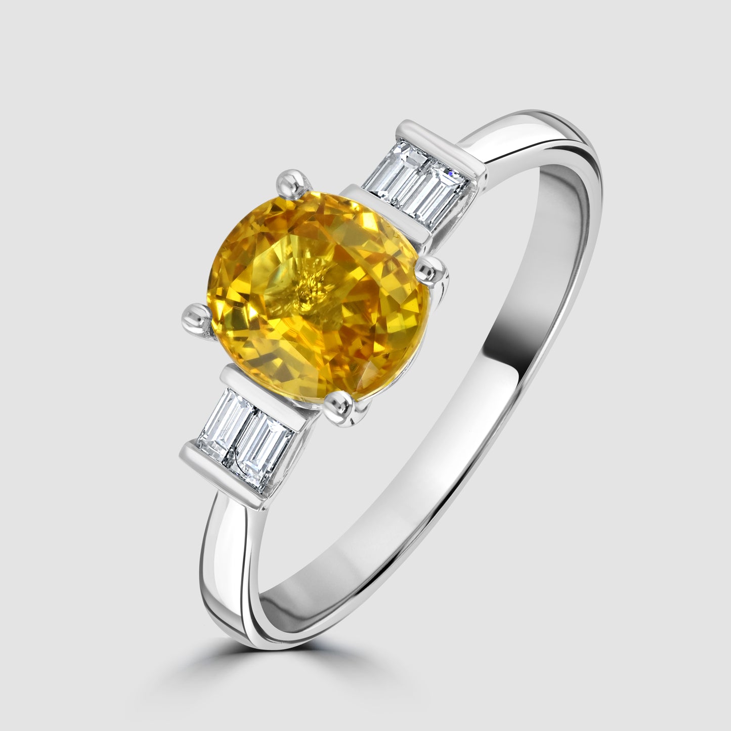 Yellow sapphire and baguette cut diamond ring