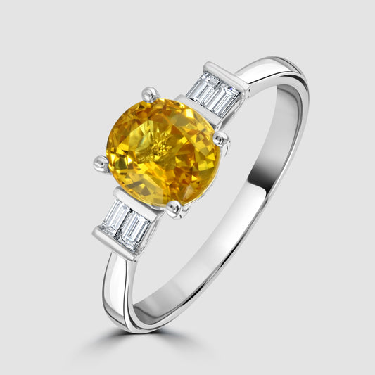 Yellow sapphire and baguette cut diamond ring