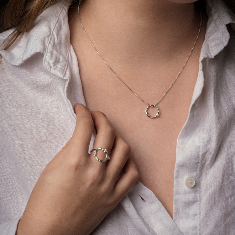 A Halo Ring and halo pendant from Lulu and Boo Jewellery.
