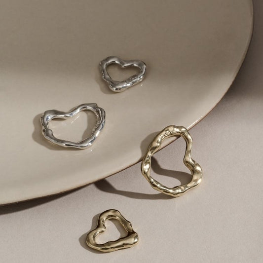 A Molten Heart Small 9ct Gold Necklace from Lulu and Boo Jewellery.
