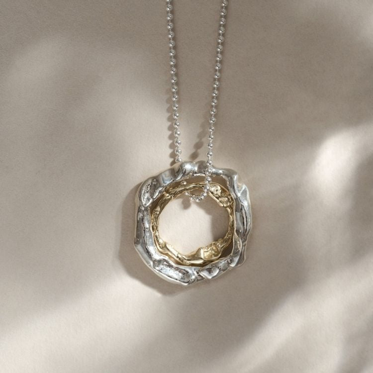An 18ct Gold Necklace with Pendant from Lulu and Boo Jewellery.