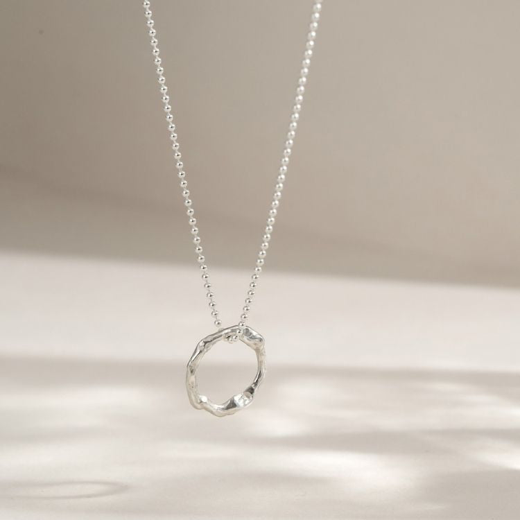A small Sterling Silver Halo Pendant from Lulu and Boo Jewellery.
