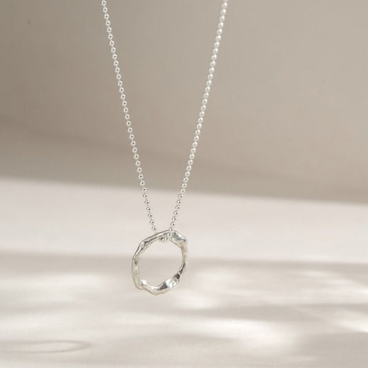 A small Sterling Silver Halo Pendant from Lulu and Boo Jewellery.
