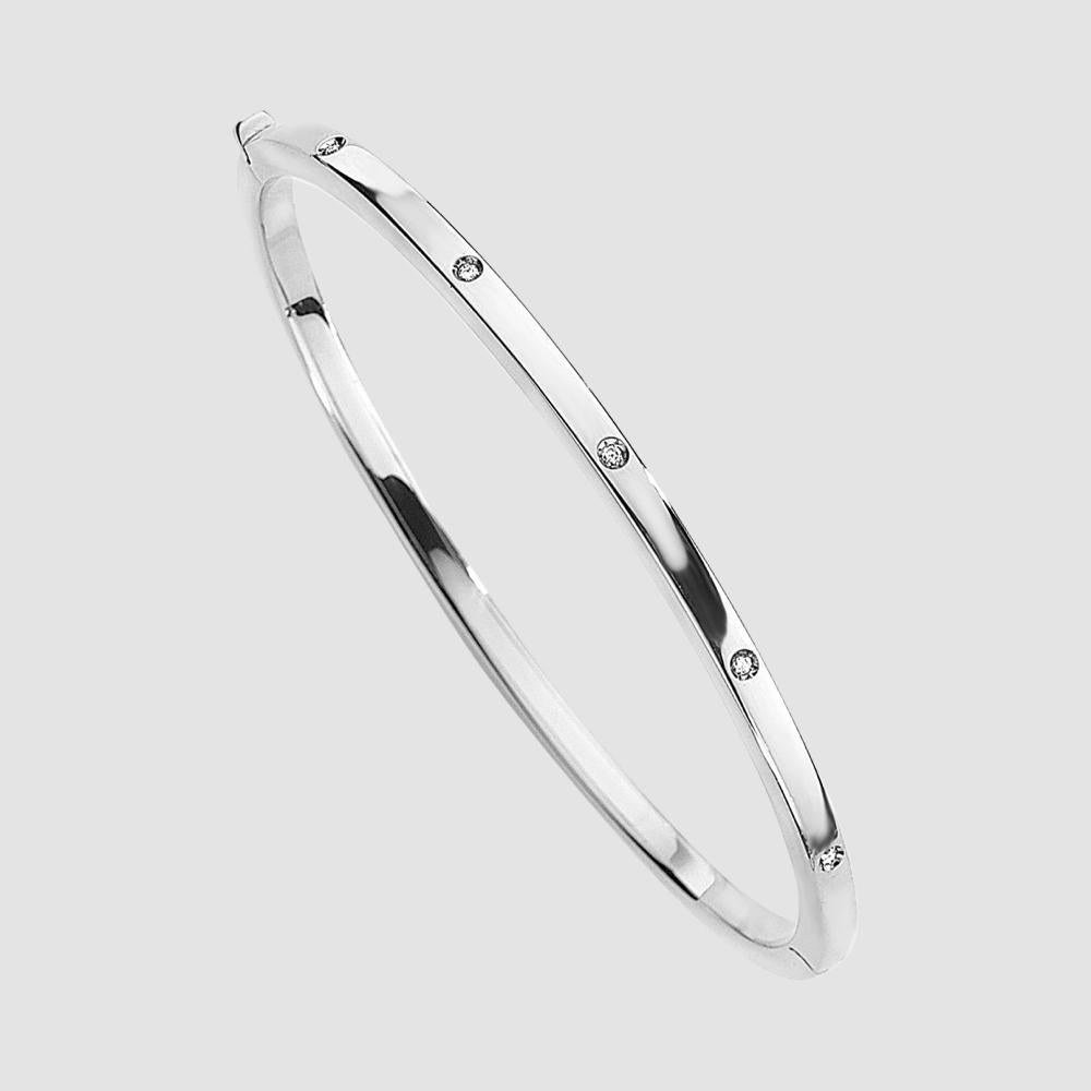 9ct white gold diamond set oval bangle