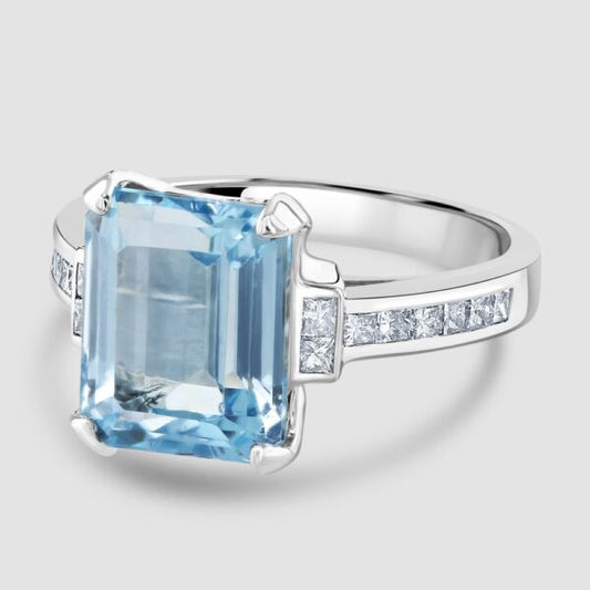 Blue Topaz and diamond single stone ring