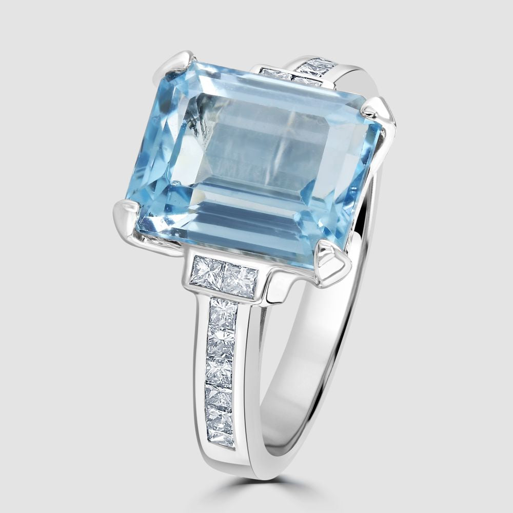 Blue Topaz and diamond single stone ring