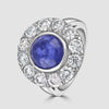 Circular cabochon sapphire and diamond cluster ring