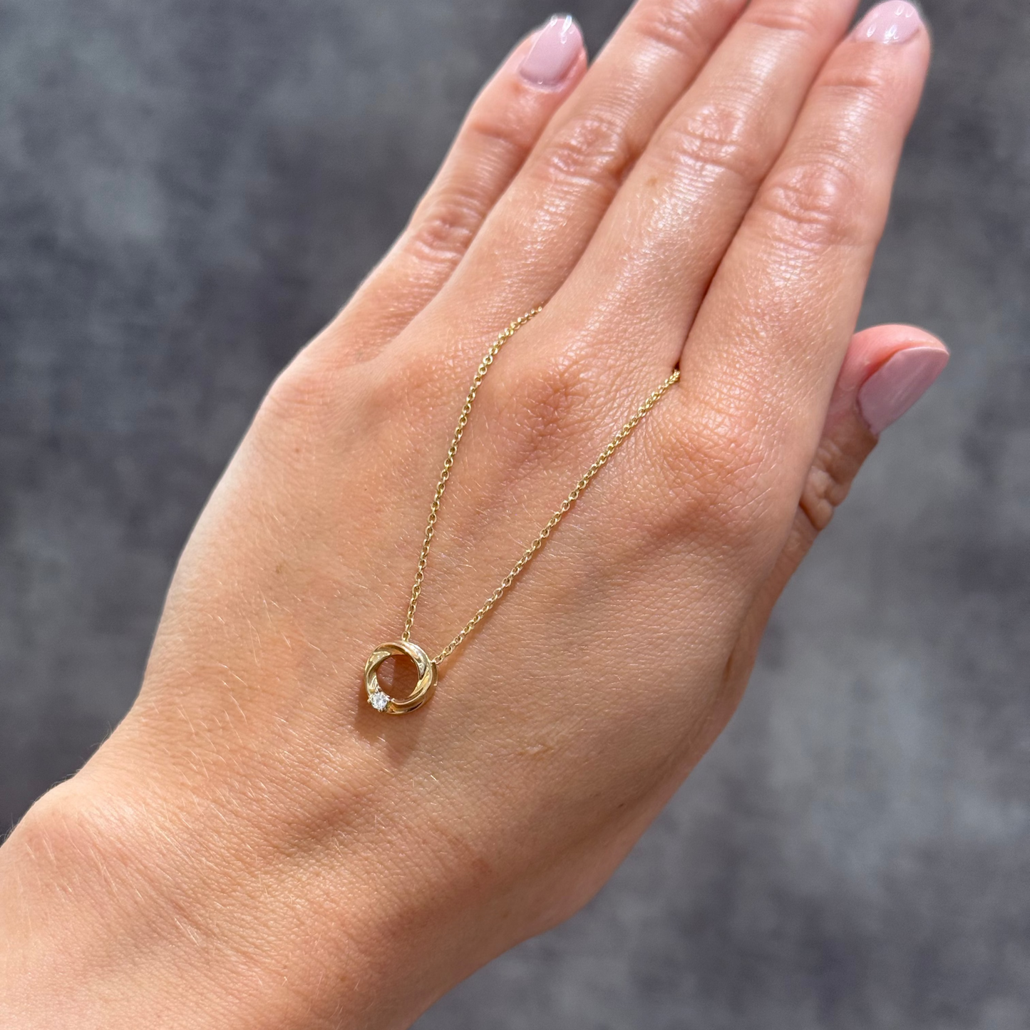Diamond set twisted circle pendant and chain