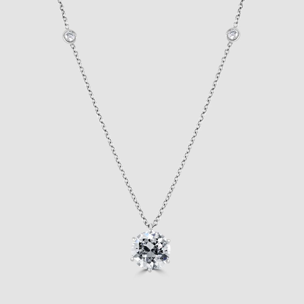 Diamond solitaire pendant with diamond set chain