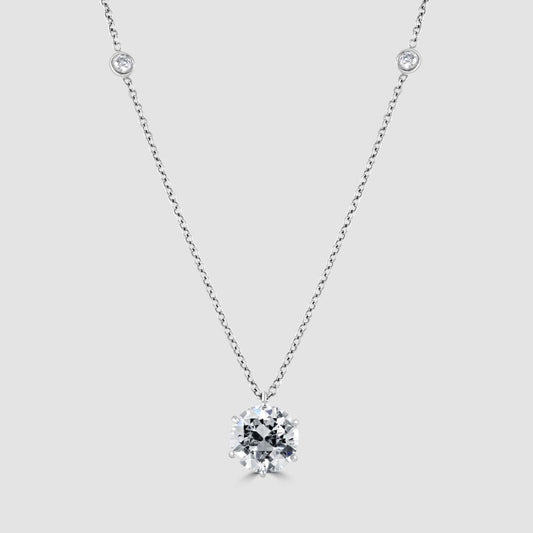 Diamond solitaire pendant with diamond set chain