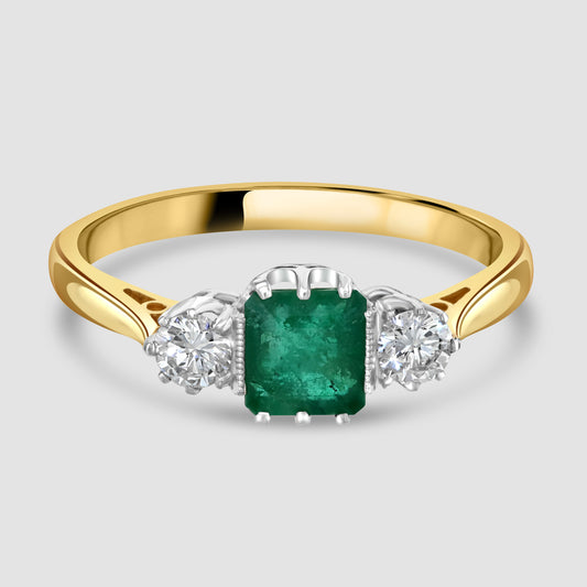 Emerald and diamond three stone ring