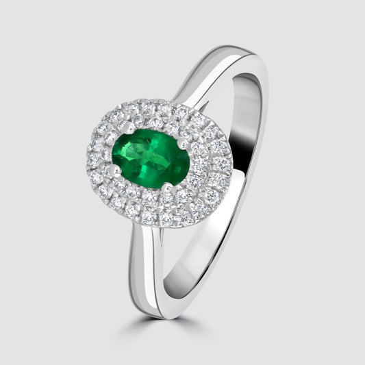 Emerald and double row diamond oval cluster ring