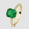 Emerald single stone with diamond set shoulders