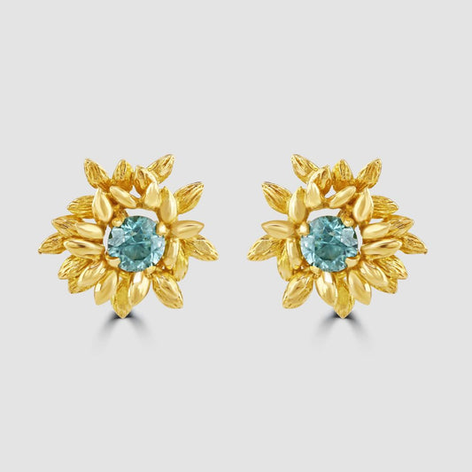 Flower stud earrings with blue zircon centres