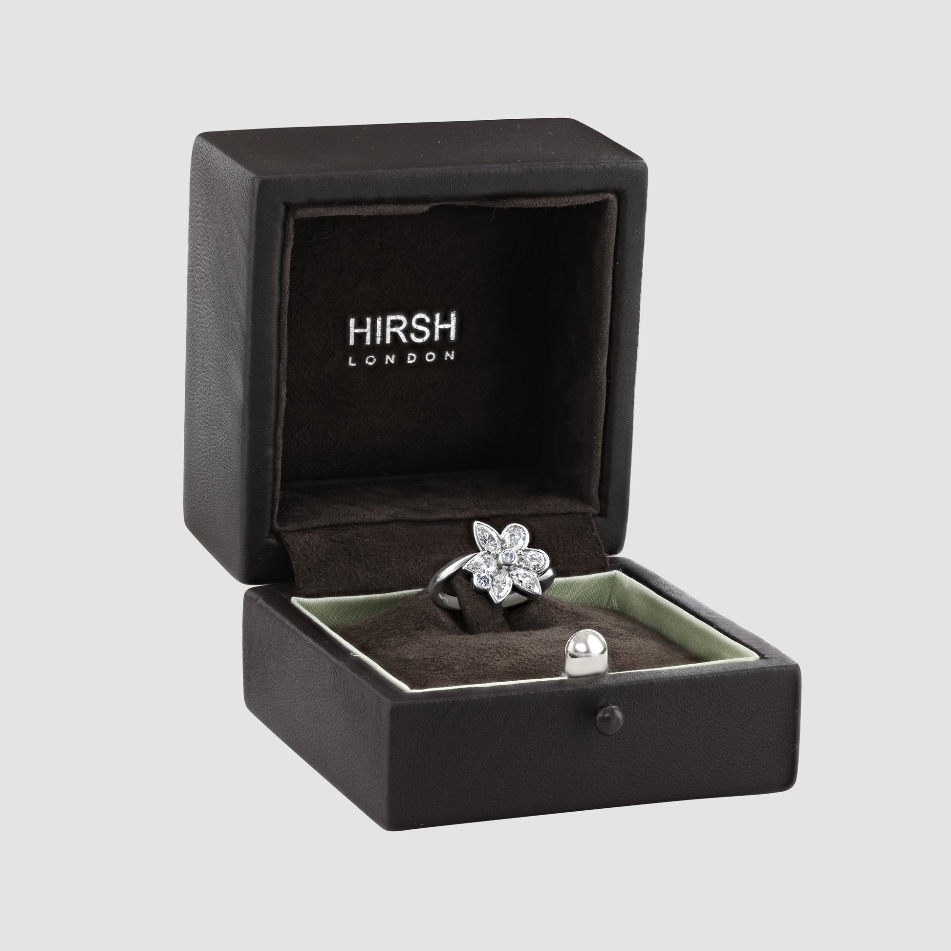 Floral white and blue diamond ring by ‘Hirsh’