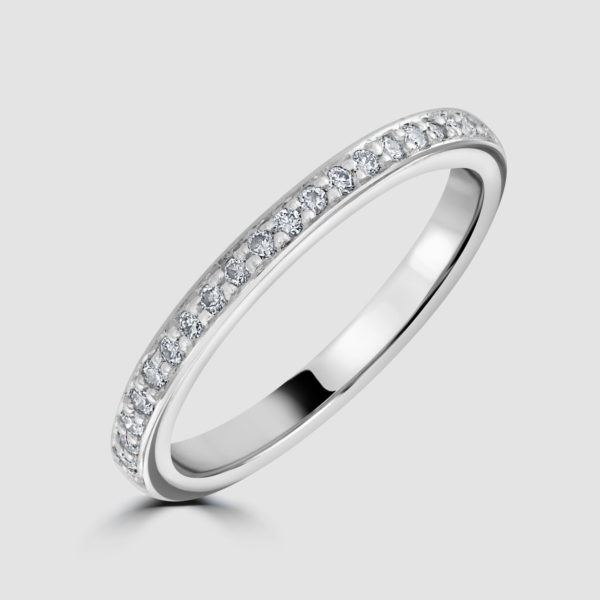 Platinum claw set diamond half eternity ring